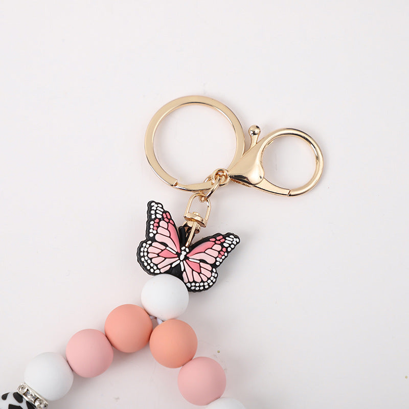 Wholesale Rubber Tassel Silicone Wood Water Keychain